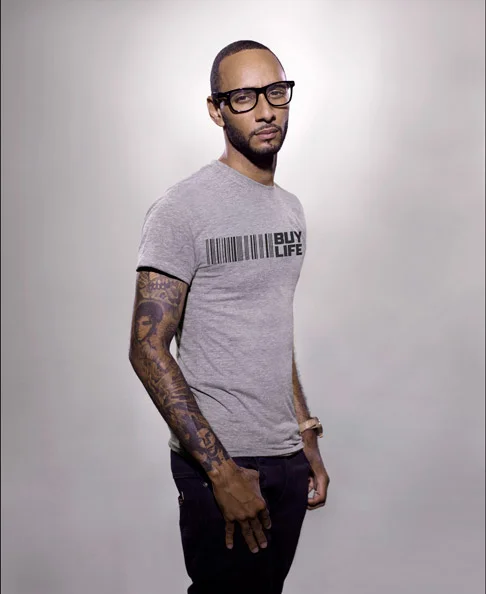 Swizz Beatz looking hot in a grey shirt and glasses.jpg