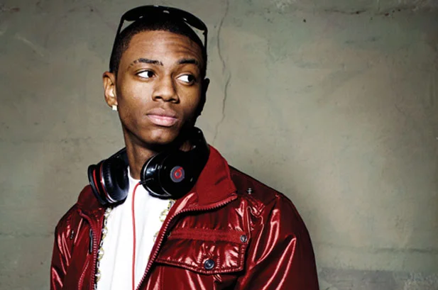 Soulja Boy looking hot in a red patent leather jacket.jpg