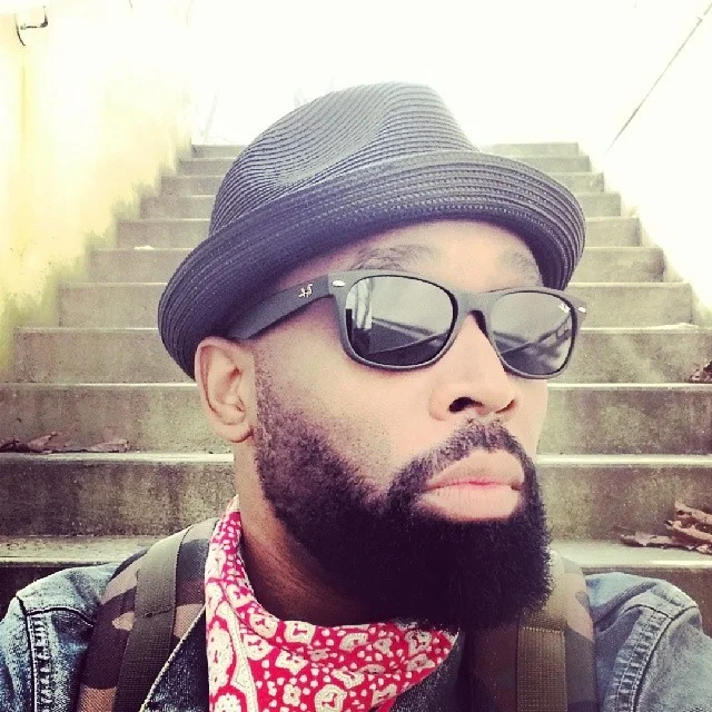 Glen Scott looking hot incognito with sunglasses on and a hat.jpg