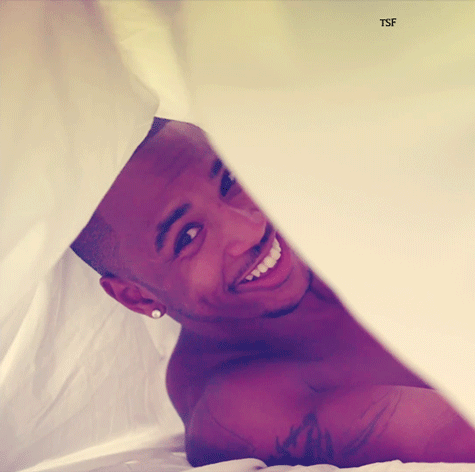 Trey Songz and his GORGEOUS smile in bed.jpg