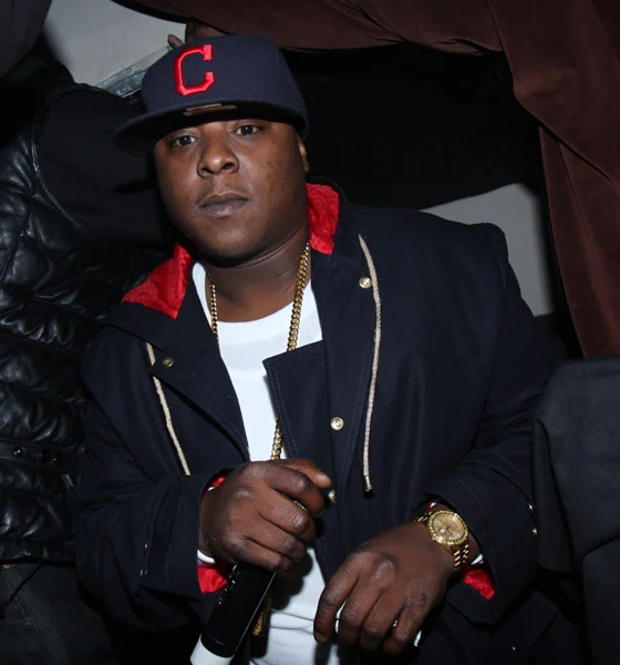 Jadakiss wearing a red and navy jacket with a hat to match it.jpg