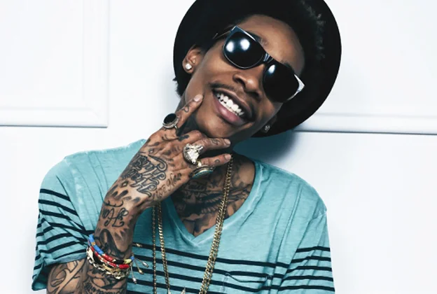 Wiz Khalifa looking really hot in a teal vneck shirt with stripes.jpg