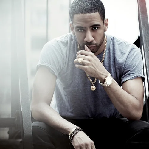 Ryan Leslie sitting down in a chair by a window looking really hot omfg.jpg