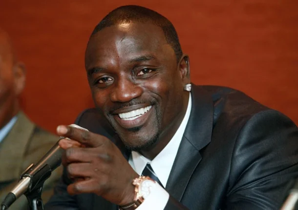 Akon wearing a suit and looking hot with his gorgeous smile.jpg