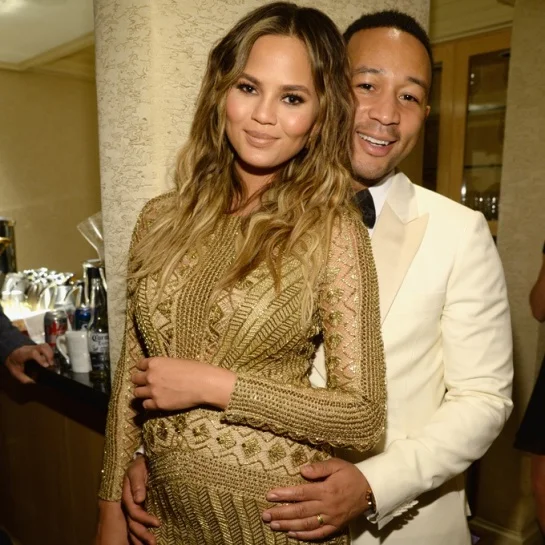 Chrissy Teigen and John Legend in a picture before their spawn is birthed.jpg