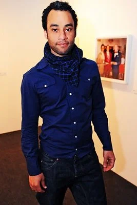Stephen Simmonds wearing a blue shirt with a matching scarf as he looks hot.jpg