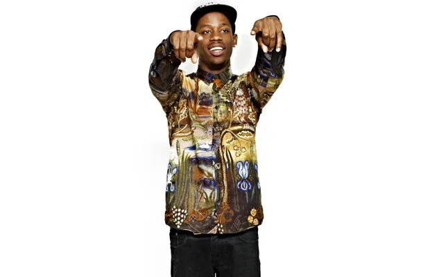 Travi$ Scott looking really hot in a graphic print shirt.jpg