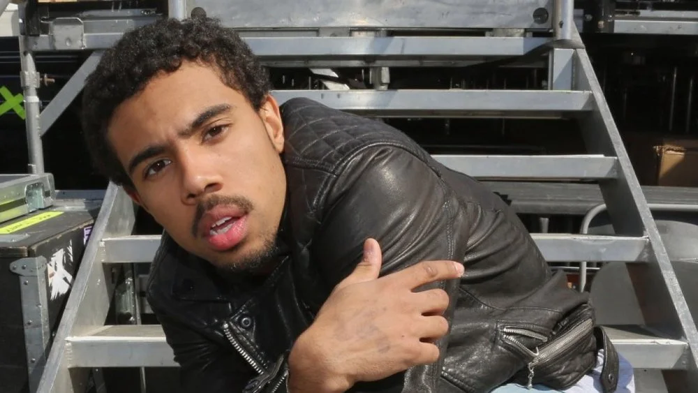 Vic Mensa looking hot on the steps of a stage.jpg
