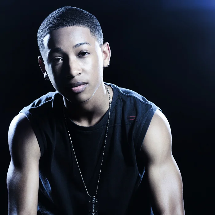Jacob Latimore and his hot arm muscles in a muscle tank.jpg