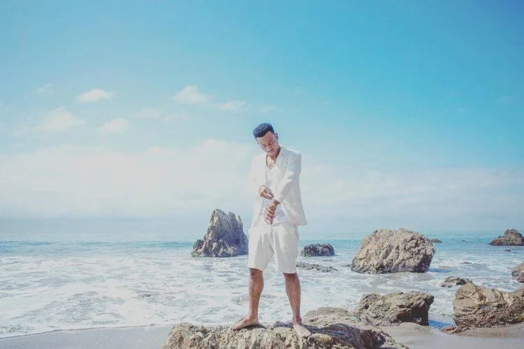 Jimmy Cozier looking hot on an island beach.jpg