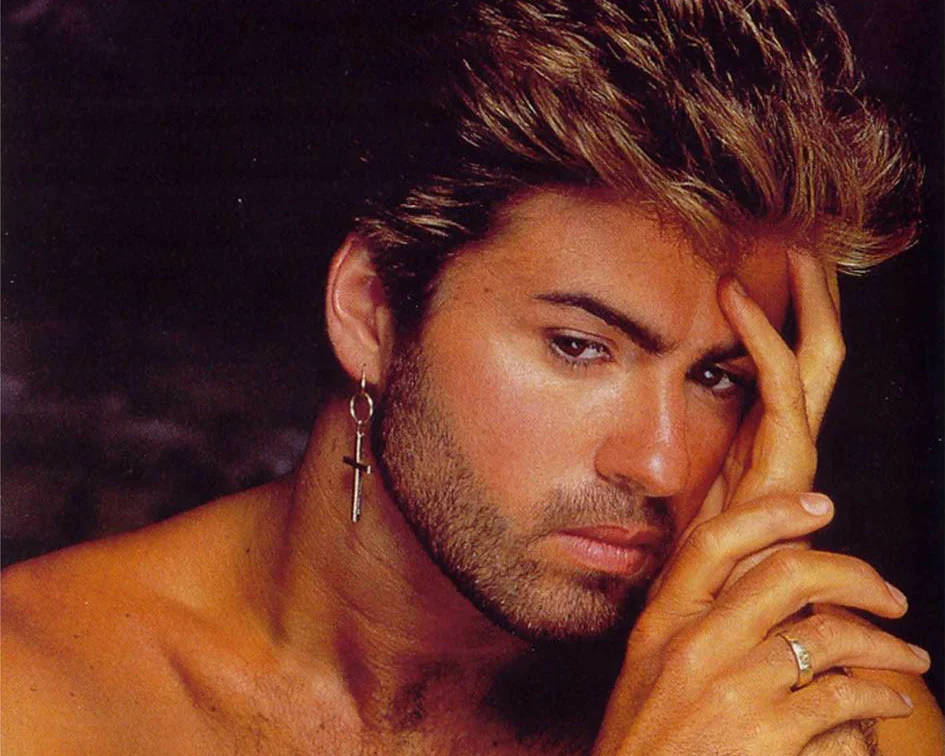 George Michael looking gorgeous shirtless with his crucifix earring in.jpg