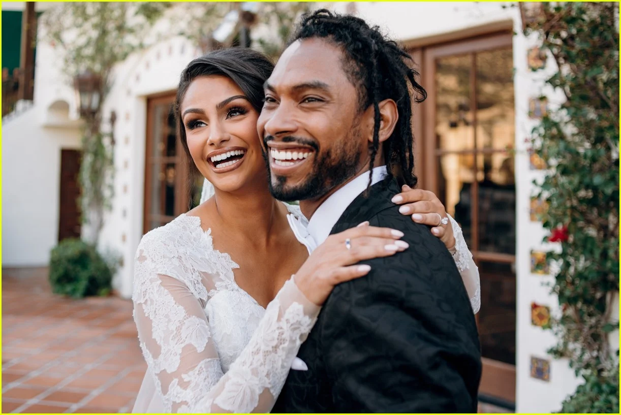Miguel and Nazanin happily smiling at their wedding.jpg