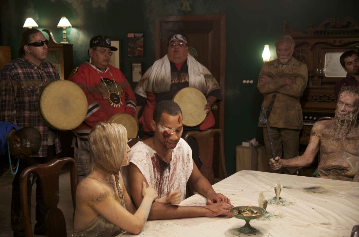 Two pharaohs conclude a battle with silent speeches at the table towards the end of Norman Mailer's wake while the Mystic River Singers sing. The elder at the head of the table is Usermare, Hathfertit's father, one of many creatures from the deep.
