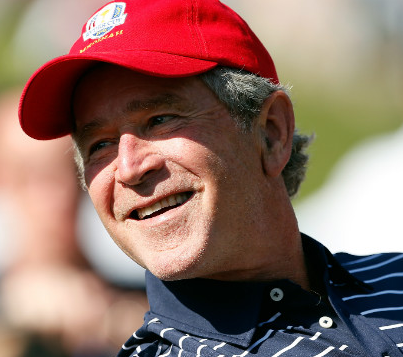 George W. Bush smiling, perhaps on a golf course. 