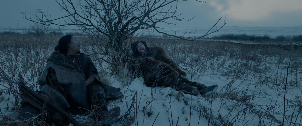 Arthur RedCloud and DiCaprio catching snowflakes on their tongues. 