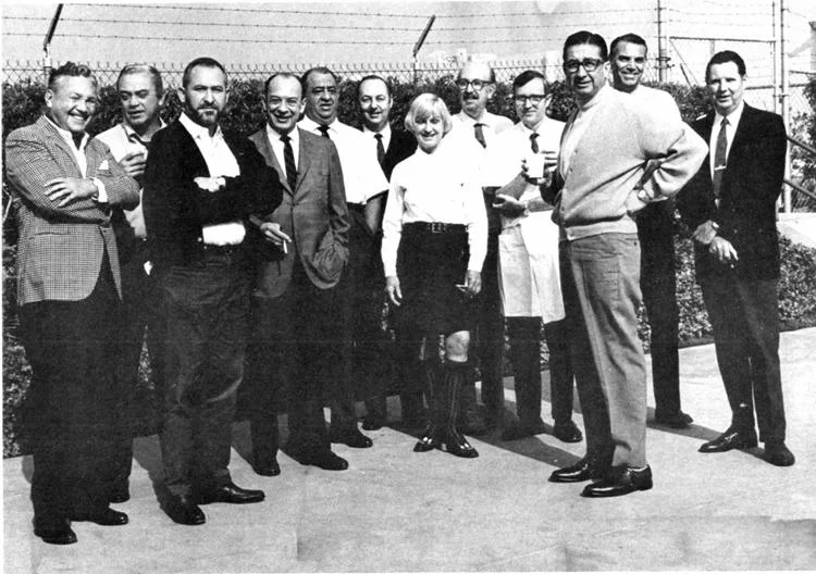 X seen here with the original Imagineering crew, (3rd from right with coffee.) 