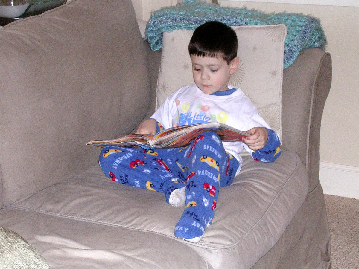 Josh "reading" a Blue's Clues book
