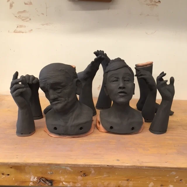 Each ceramic componet stats off with a black layer of underglaze.