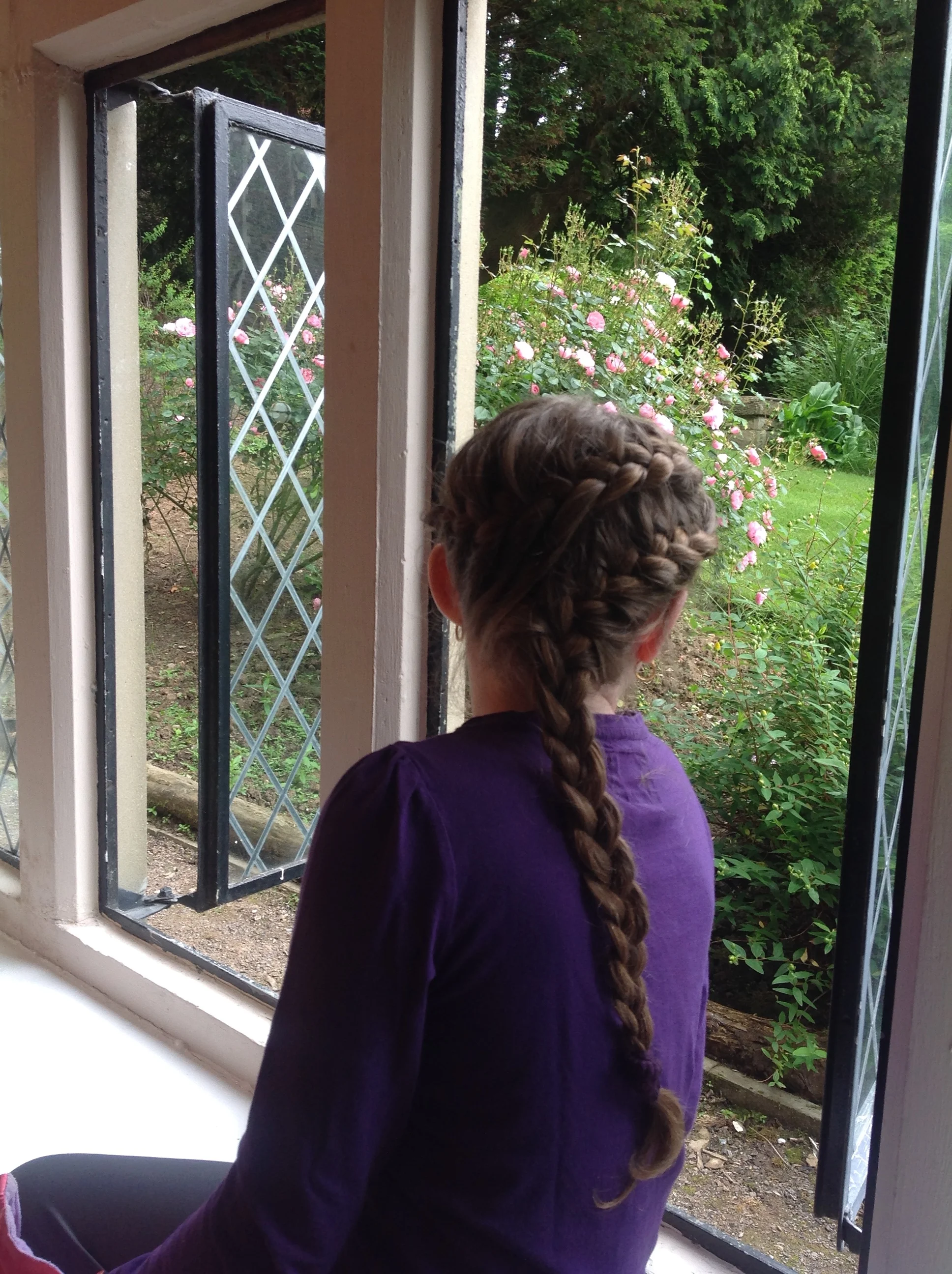 Kiddo, admiring the window seat view of the gardens and the feel of amazingly fresh air in Wales.