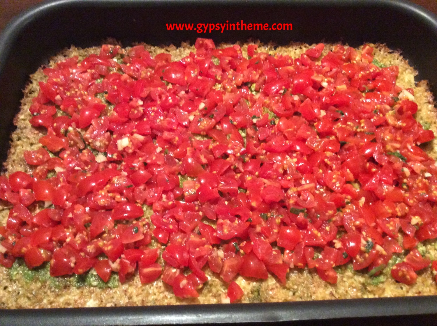 Add the homemade bruschetta mix. And ''voila''! Bob's your uncle ... Pesto-cauliflower crust bruschetta pizza. I CANNOT tell you how delicious this tastes. Feel free to make it your own, by adding cheese, spinach, meats, or anything else that tickles your fancy. It's a keeper.