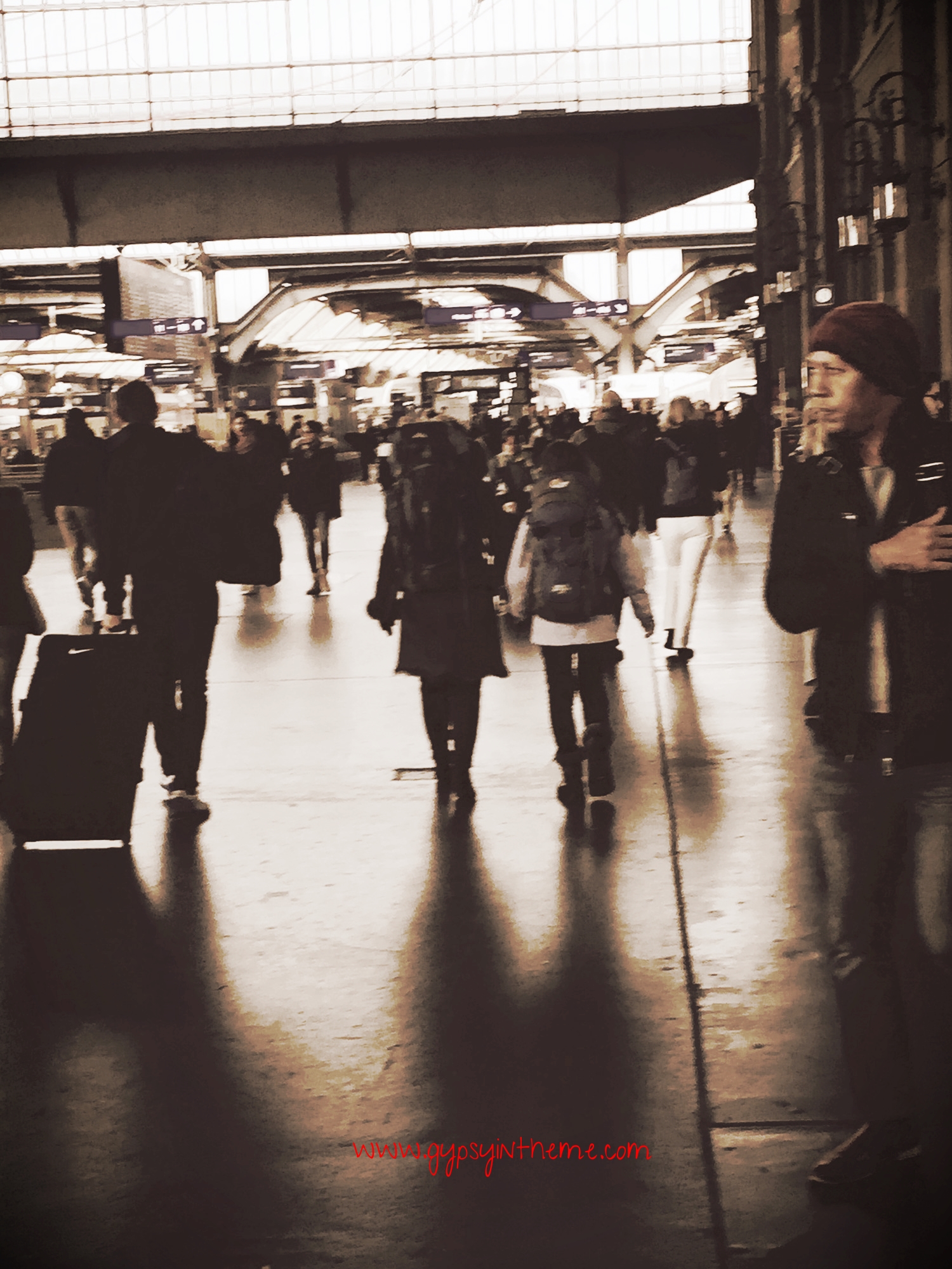Kiddo and me traipsing through the Main Bannhof, Zurich.