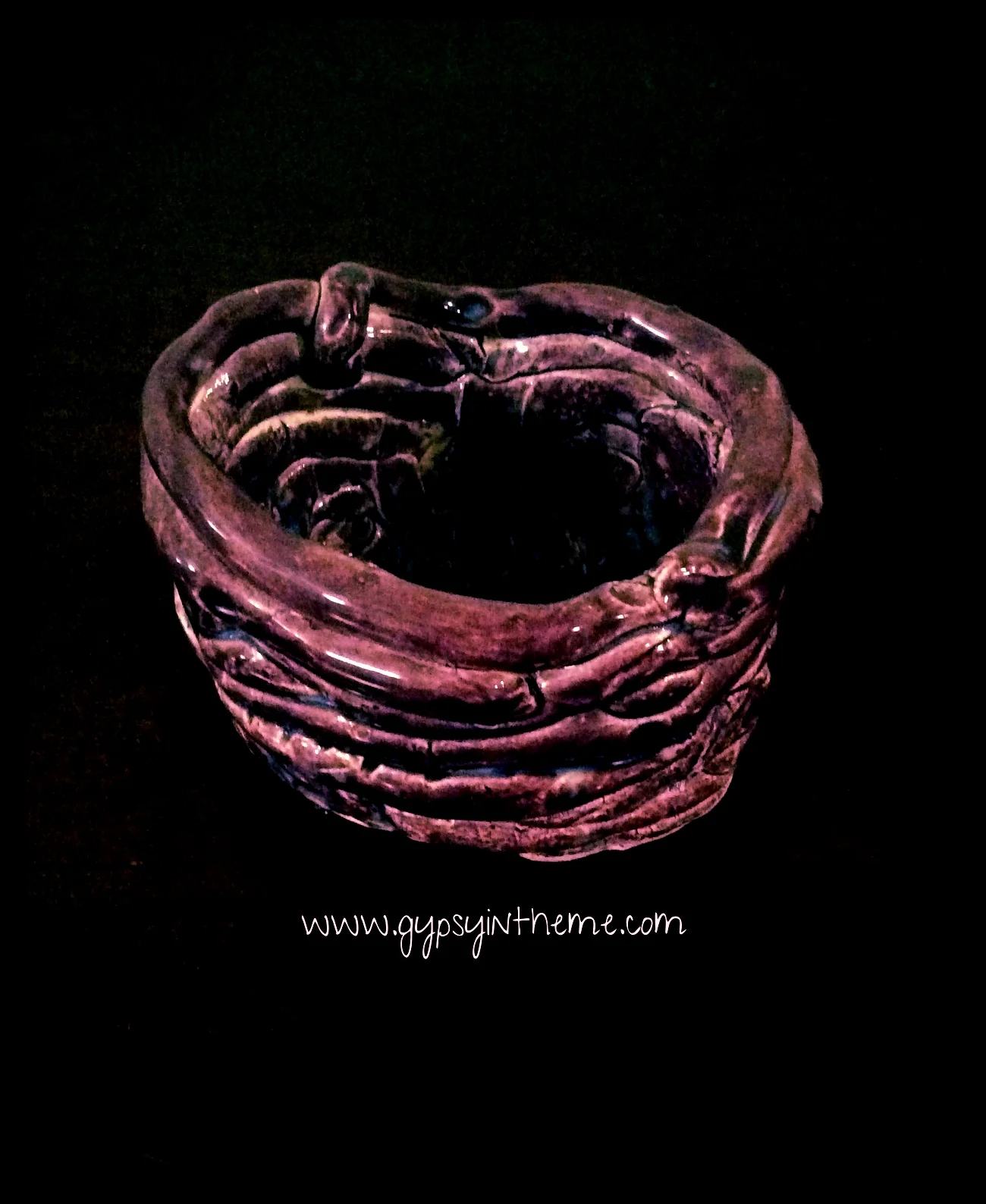 Odd bottomless 'poo coil' clay vase fashioned and fired by Kiddo in Grade 2 ... this one's too much of a conversation piece to get rid of.