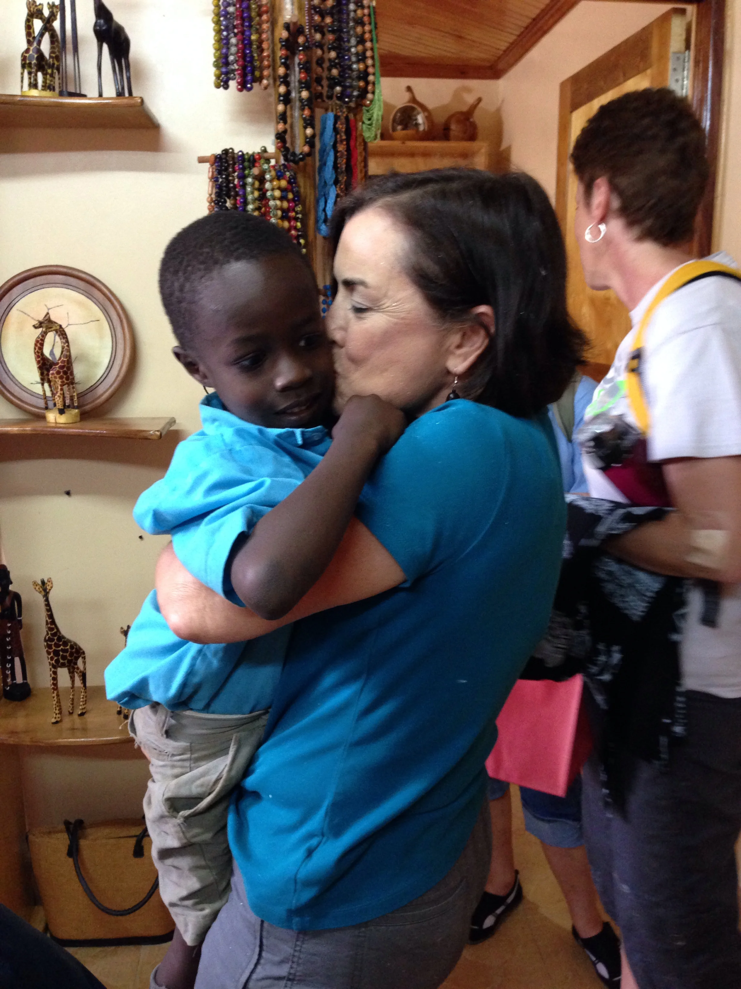 Claire with Richard, the child she & her husband sponsor.