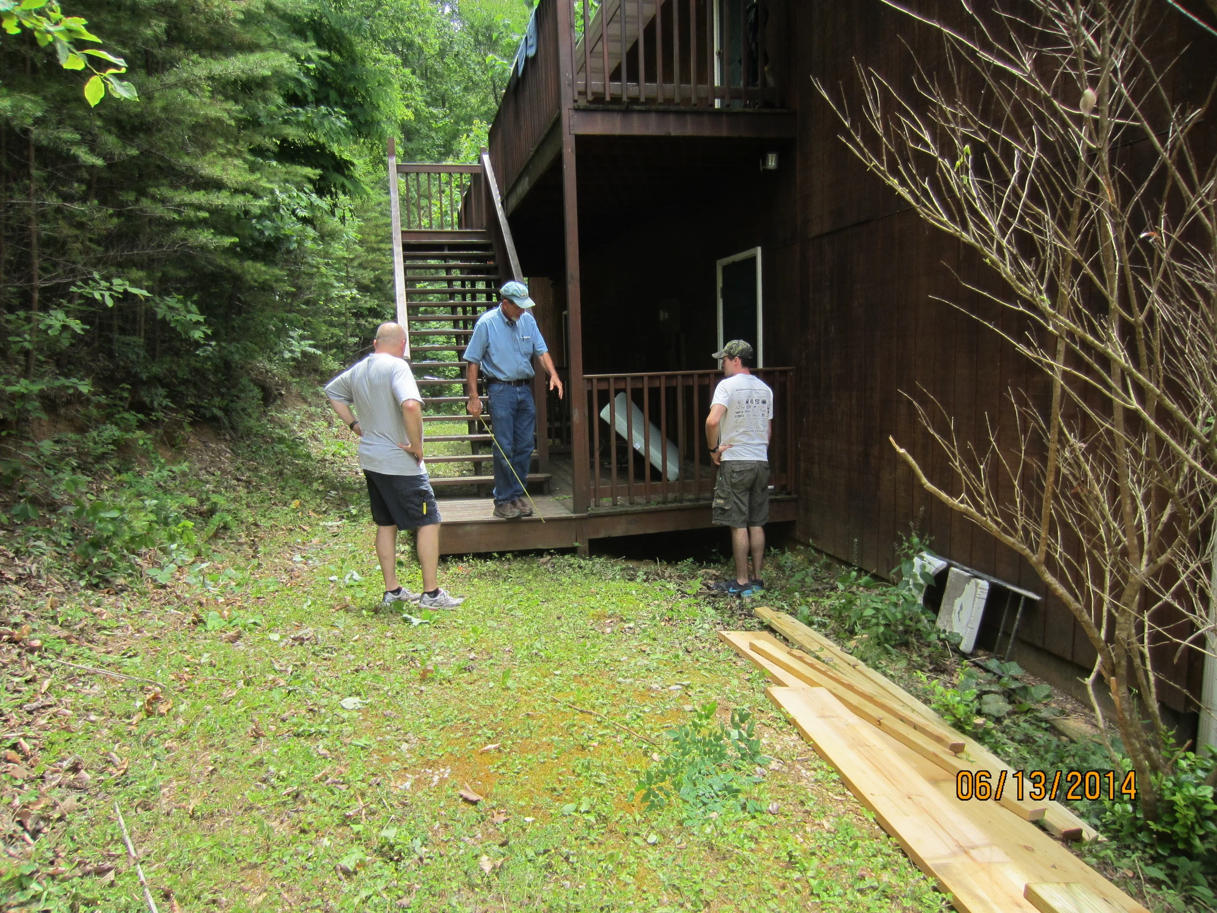 Preparing to build new steps at the Dormatory. Evan and Phillip Stout with Mr. Pat.