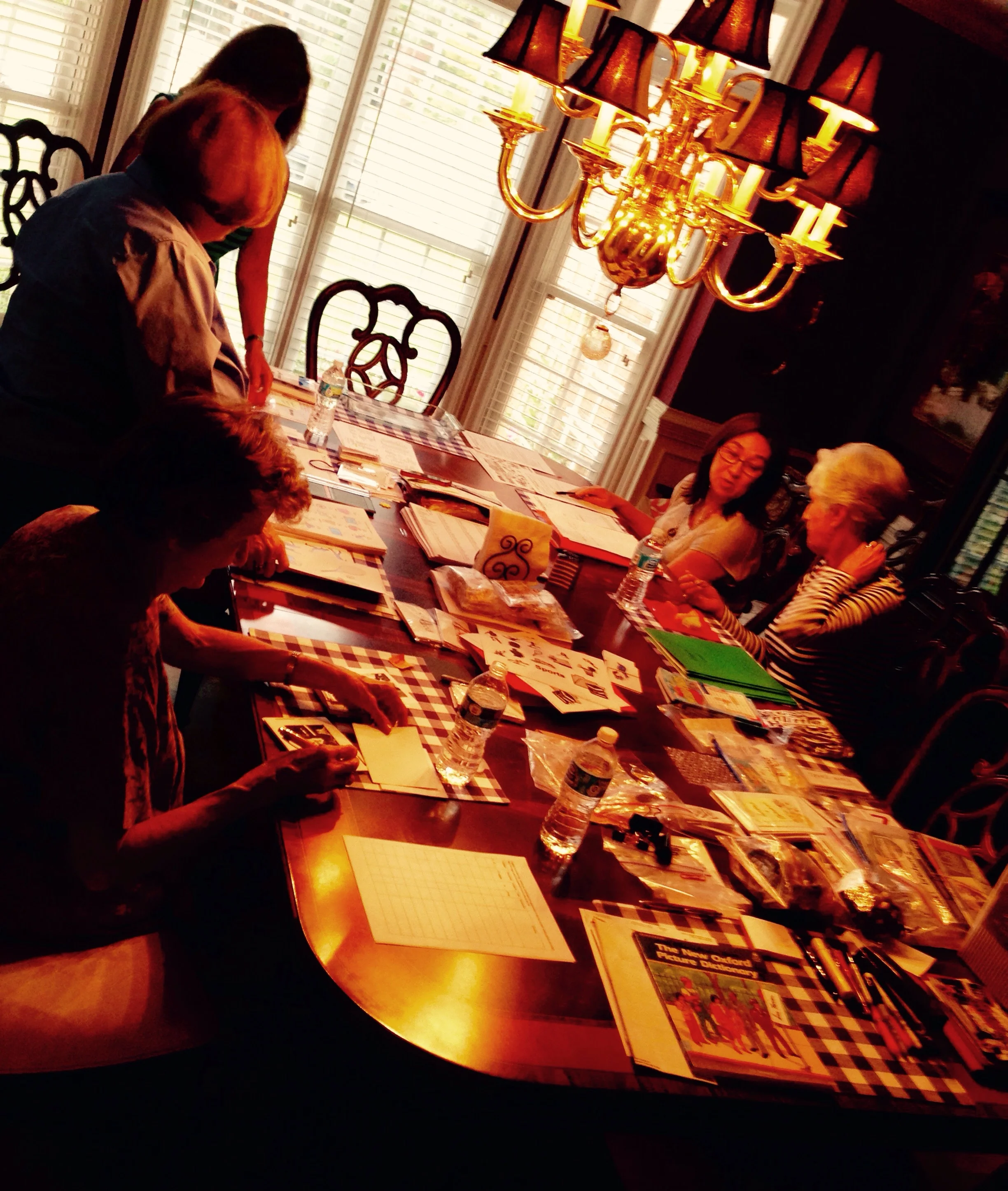The women were putting image flash cards together for the classes.