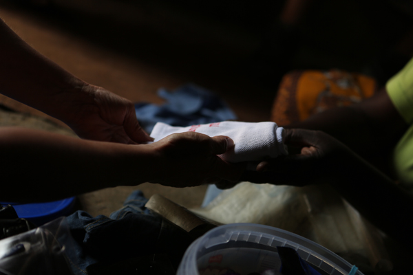 Lisa is presenting a towel to one of the sewing ladies reminding them that we love them and Jesus loves them so much more.