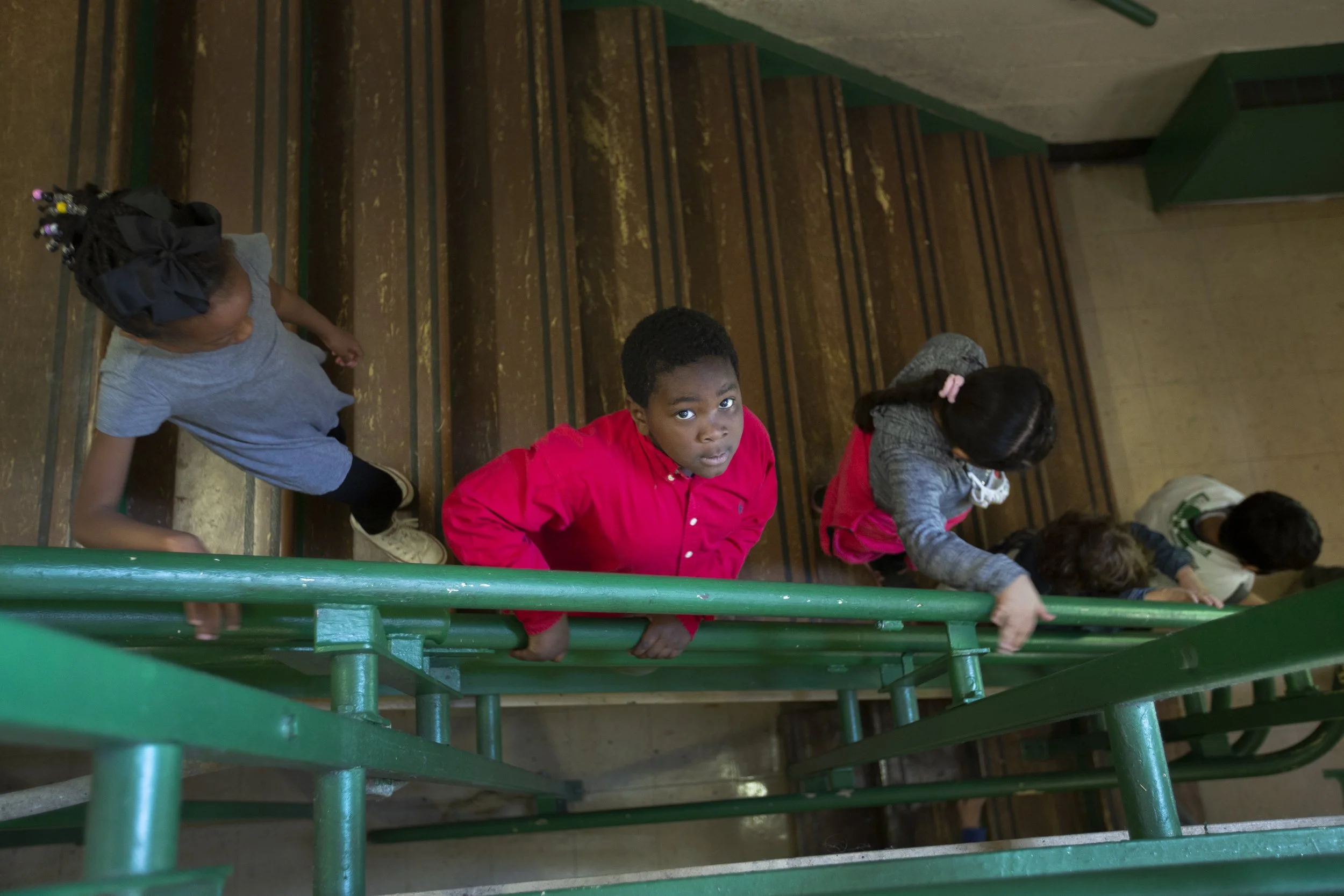 Kindergartener Jeremiah Jensen walks down a flight of steps inside McDowell Elementary School in Columbia, Tenn., on Monday, April 19, 2021.