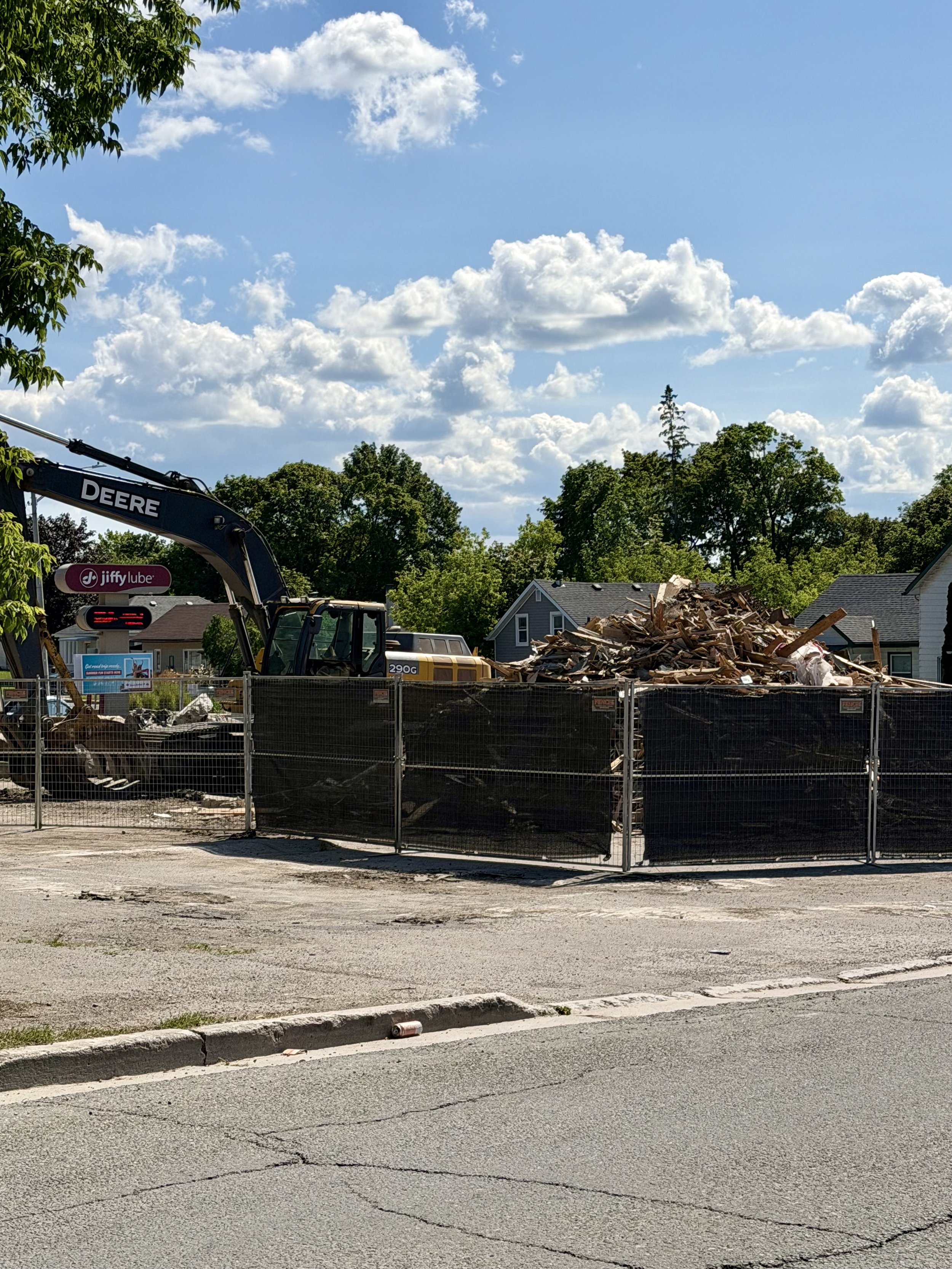 Heavy equipment clears the site where a familiar corner business once welcomed customers for years.