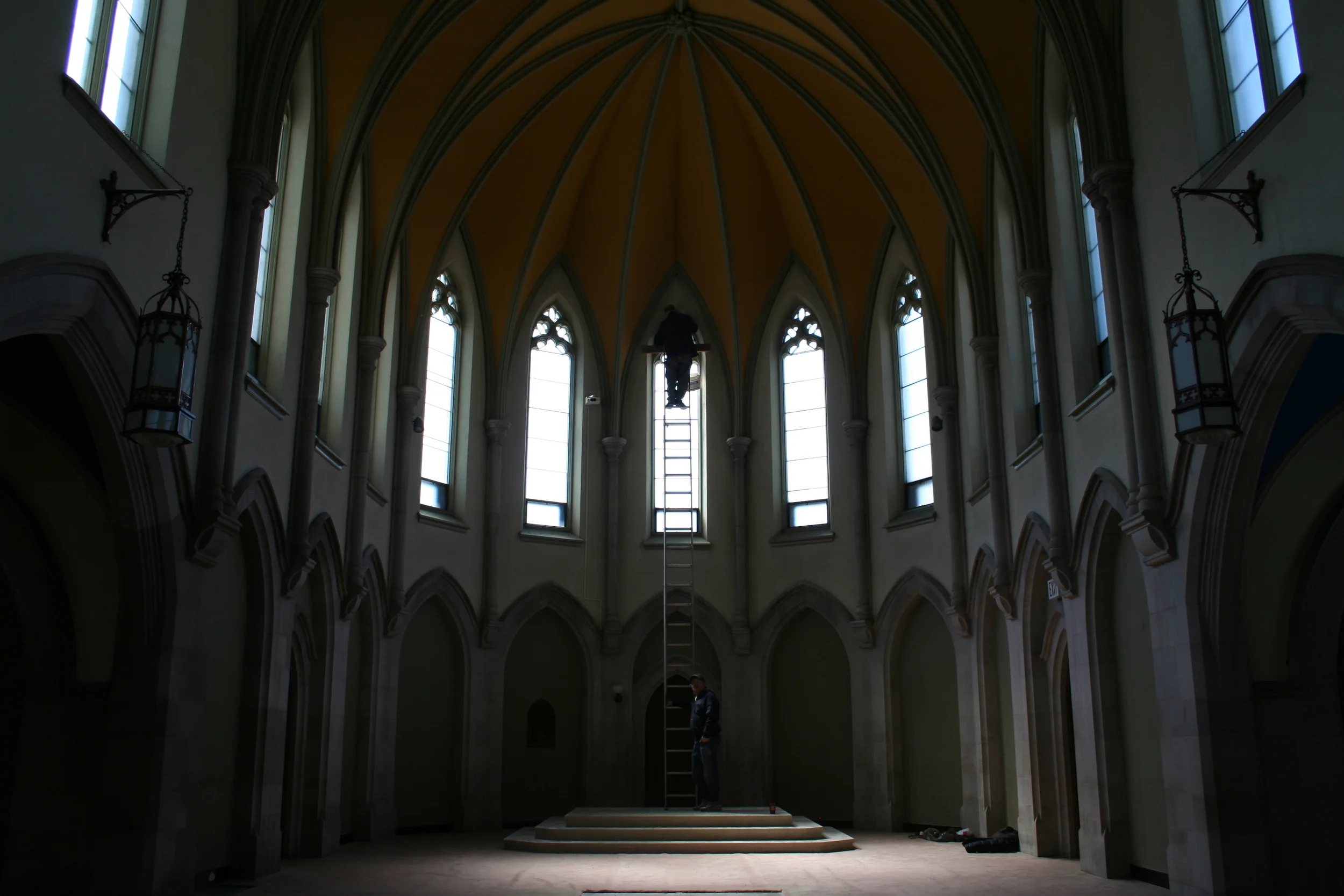 Public Energy Artistic Producer Bill Kimball helping Artist Robert Edmonson install his kinetic sculpture in the Chapel. Photo: Paul Oldham