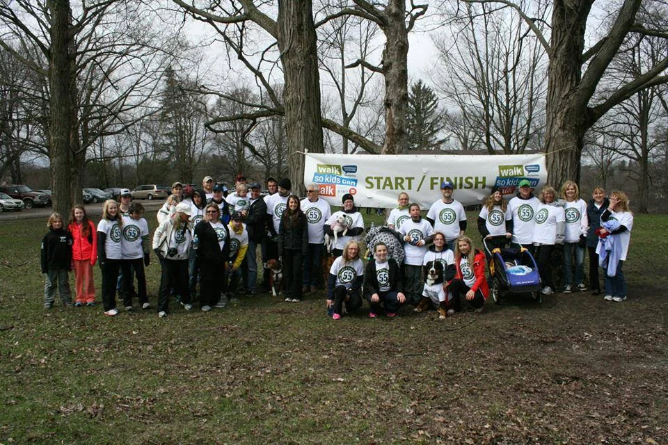&nbsp;Team 55 gathers by the finish line at the end of the walk