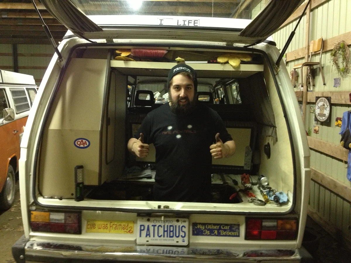 Ken working in and on the engine