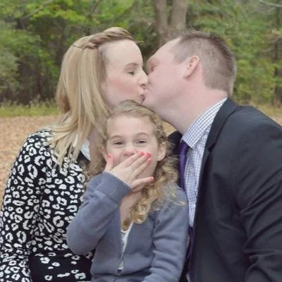 Joel Willett with his fiancé and daughter