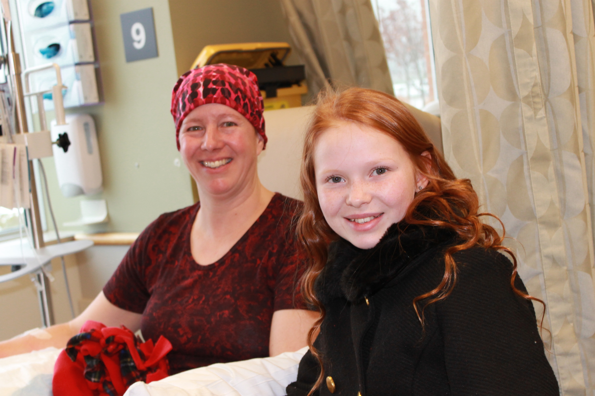 Faith (at right) with a patient