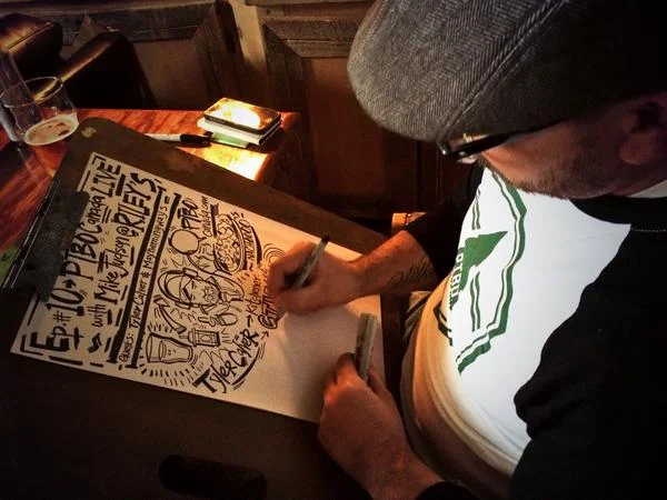 Artist Jason Wilkins illustrating podcast (photo Maryam Monsef)