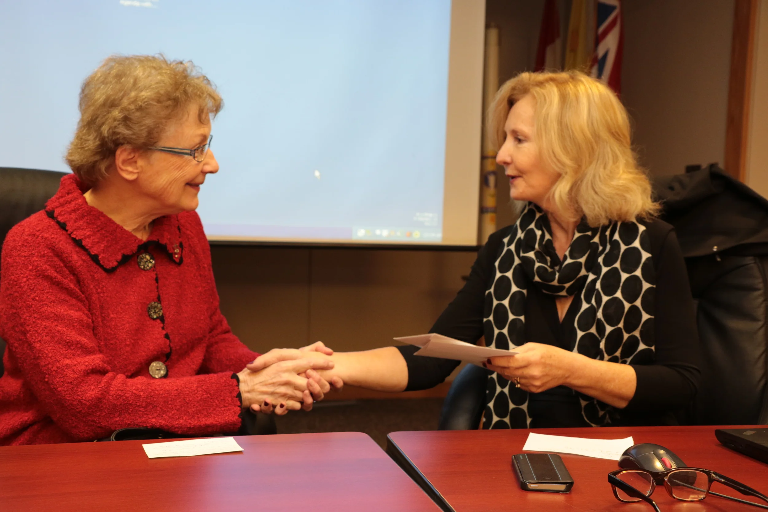 Barbara McMorrow (right), Director of Education for PVNC, presents Sister Ruth Hennessey of Peterborough’s Casa Maria Refugee Homes with cheque for $27,500