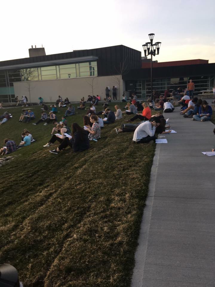 Trent Forensic Class writes exam outside (photo via Trent University Forensic Class Facebook page )
