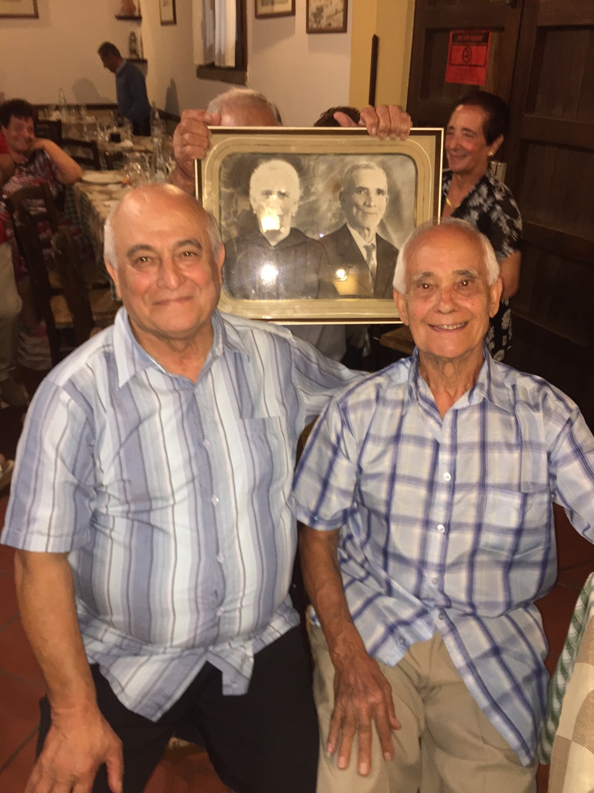 Sam and Joe together in Sicily (the picture in back is their grandfather Giuseppe Ferreri)