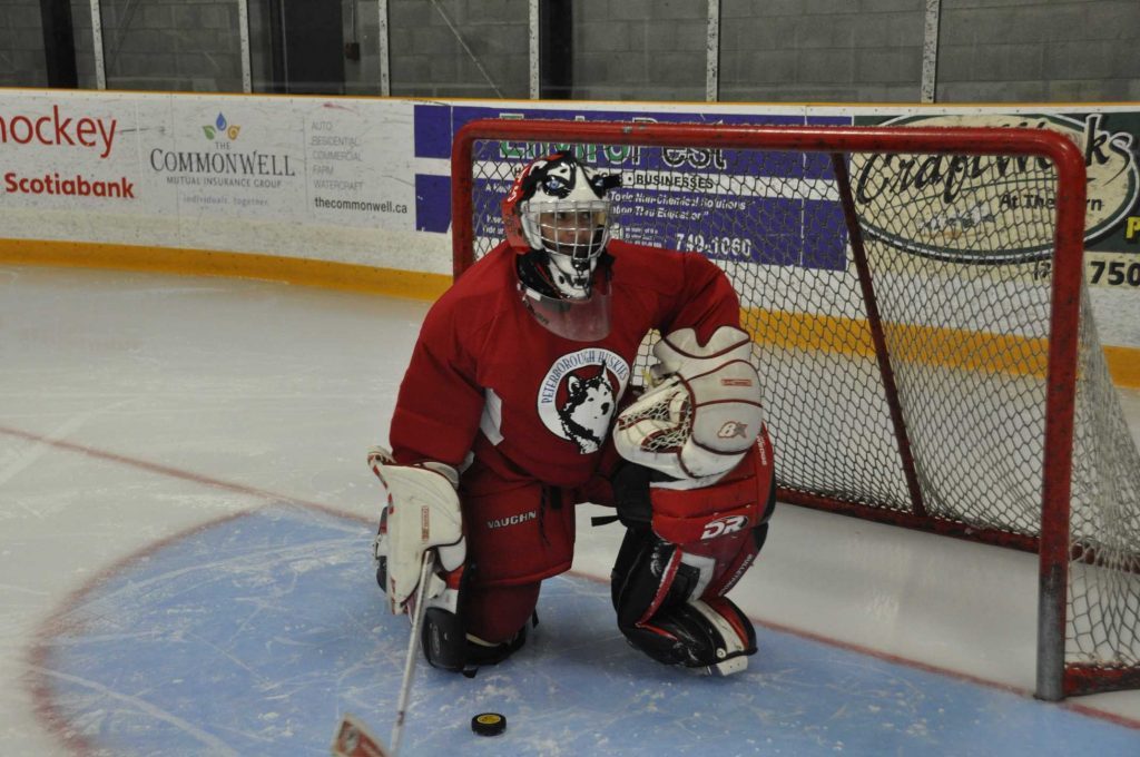 Eathon playing goal for the Peterborough Huskies