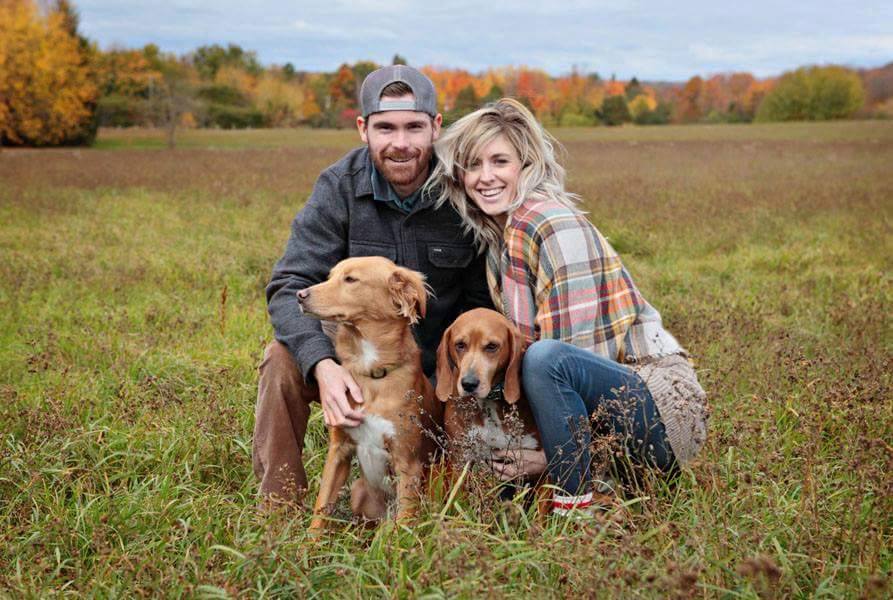 Engagement photo of Jesse and Niki with their rescue dogs taken by Kathy Jones Traynor