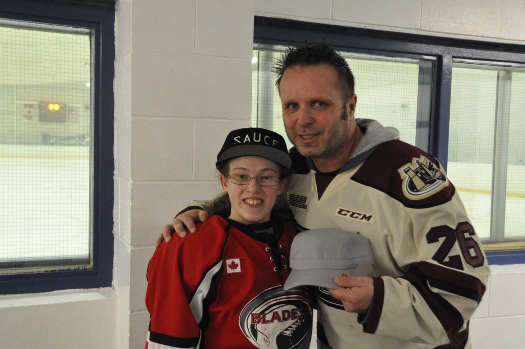 Peterborough Huskies coach Chris J-Boy Williams with one of players