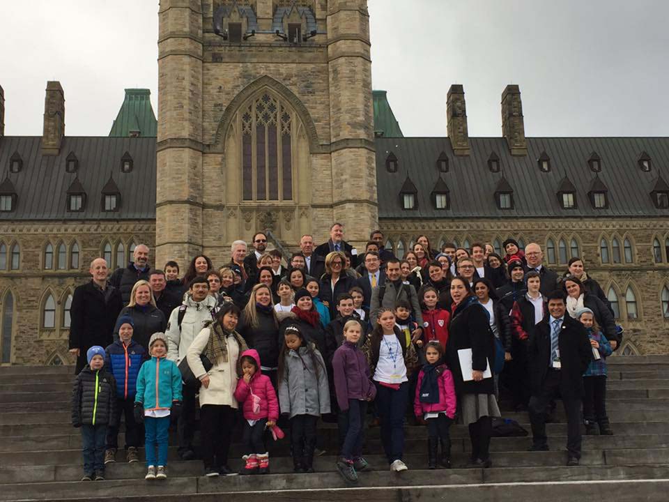 Tilly bottom row (second from left) pictured with the rest of the kids and their parents from across Canada