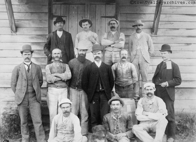 R.B. Rogers, pictured in the dark jacket near the centre, with his team.
