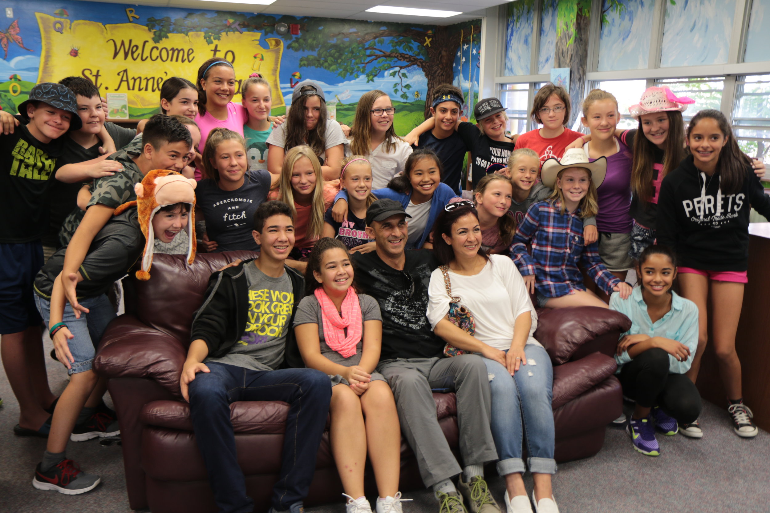 Lilas Aidak, along with her her husband Amjad and children Karam and Zeina, visit St. Anne Catholic Elementary School in September 2015, telling her family's story and helping to launch a fundraising campaign to sponsor her siblings and bring them to Canada.