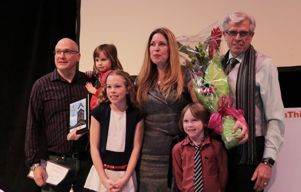 tina pictured with her husband, children and father after winning Win This Space