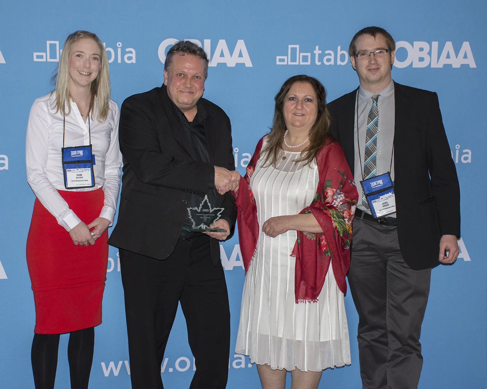  (L to R): Sam Sayer, DBIA Board Representative and owner of Sam’s Place; Terry Guiel, DBIA Executive Director; Sue McDowell, OBIAA president; Joel Wiebe, DBIA Communications Manager.