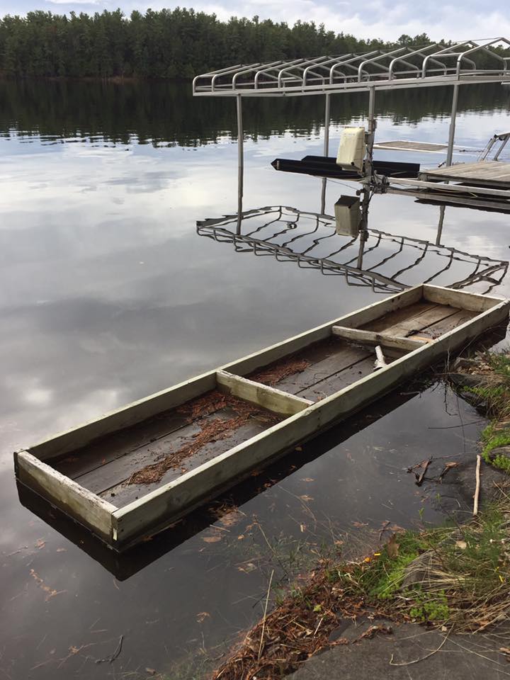 Dock that has floated to shore on Stoney Lake